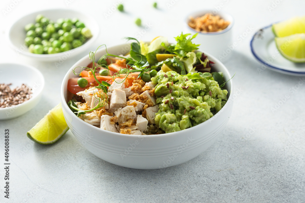 Healthy bowl with chicken and avocado