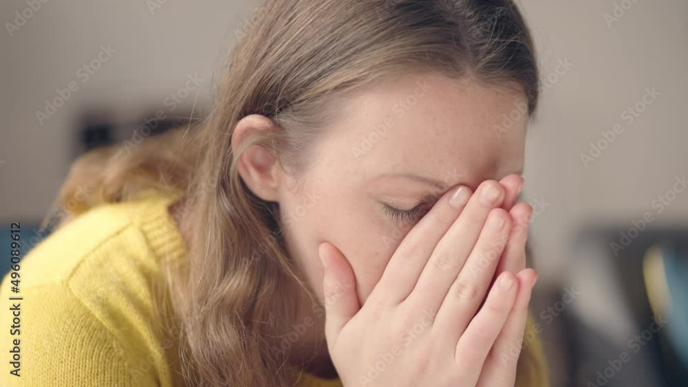 Woman crying, hiding face in hands, suffering from toxic abusive relationship Woman crying, hiding face in hands, suffering from toxic abusive relationship
