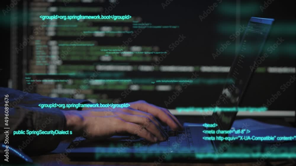 Programmer's hands and laptop keyboard close-up. The developer writes the application code Programmer's hands and laptop keyboard close-up. The developer writes the application code