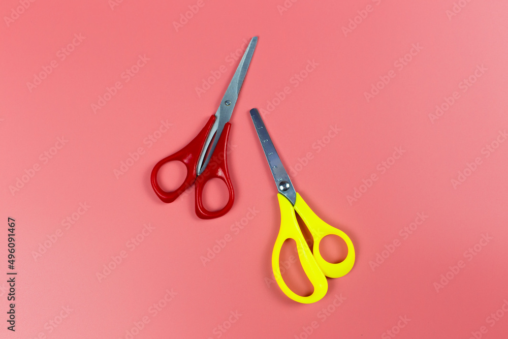 scissors on red backgound scissors on red backgound