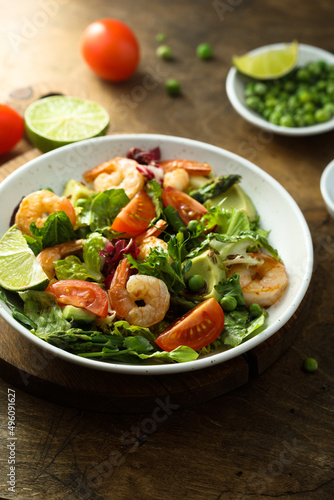 Healthy green salad with shrimps and avocado
