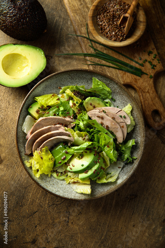 Healthy green salad with chicken and avocado