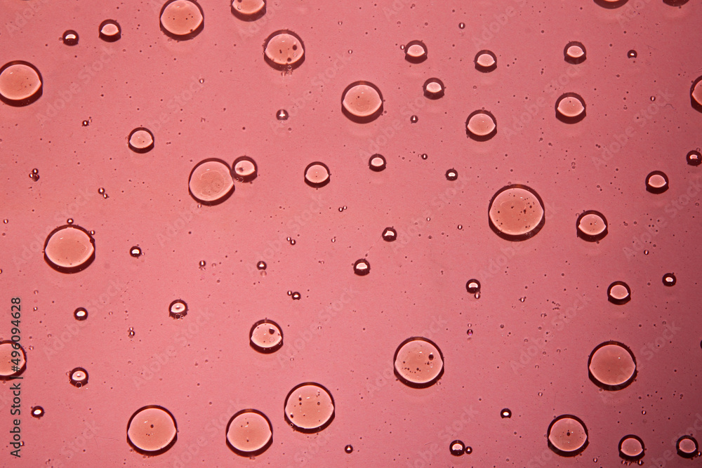 multicolor water background with bubbles . Macro olive oil on pink background multicolor water background with bubbles . Macro olive oil on pink background