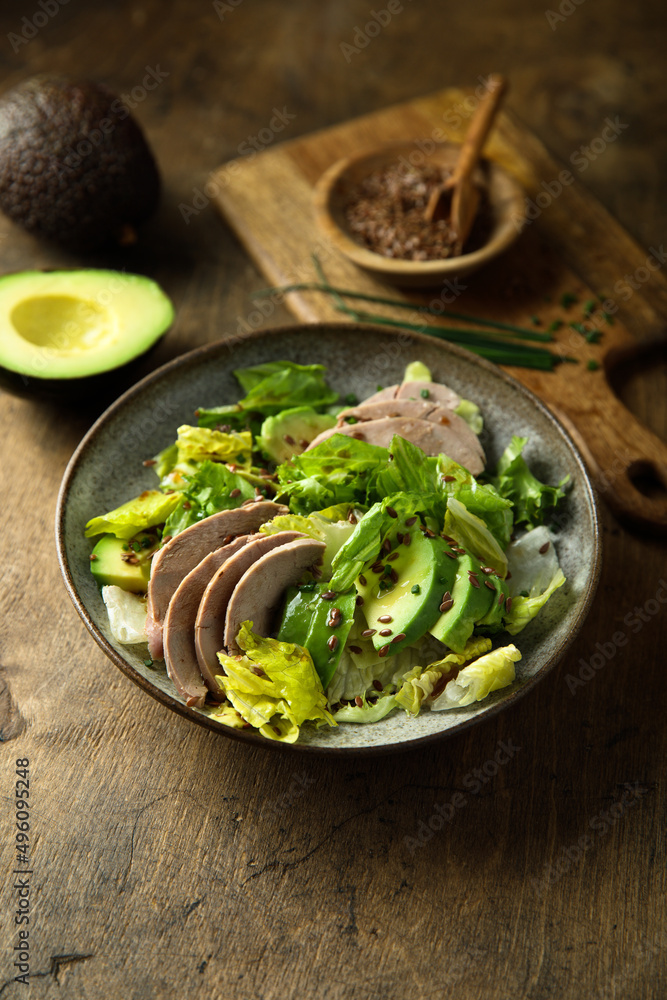 Healthy green salad with chicken and avocado