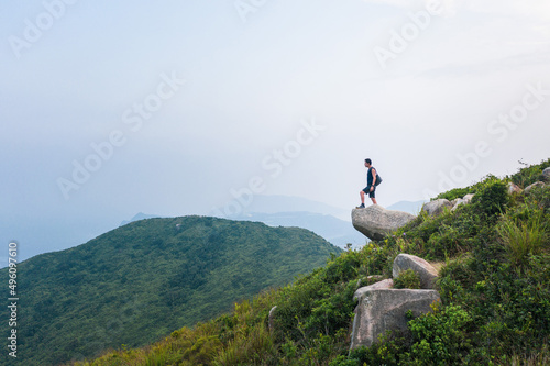 Photography Hiking man on cliff alone