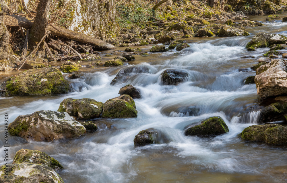 A flowing water with a long exposure time in a national park in Romania called Cheile Carasului A flowing water with a long exposure time in a national park in Romania called Cheile Carasului