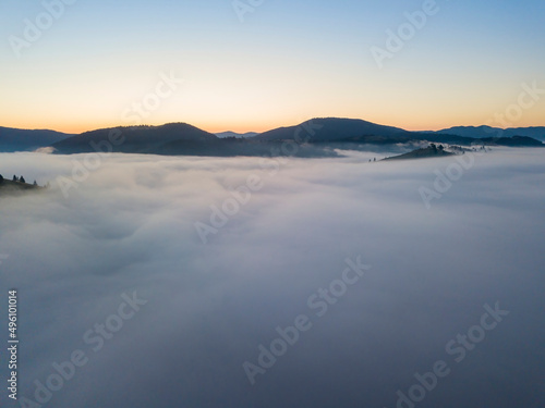 Morning fog in the Ukrainian Carpathians. Aerial drone view. © Sergey