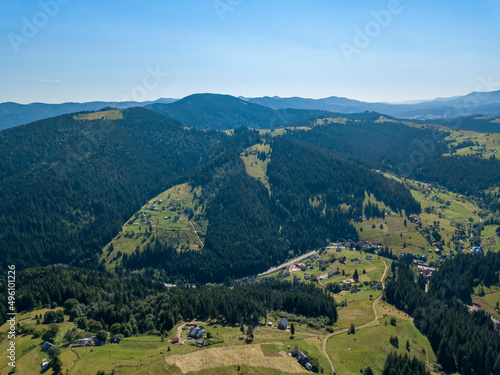 Wallpaper Mural Green mountains of Ukrainian Carpathians in summer. Sunny clear day. Aerial drone view. Torontodigital.ca