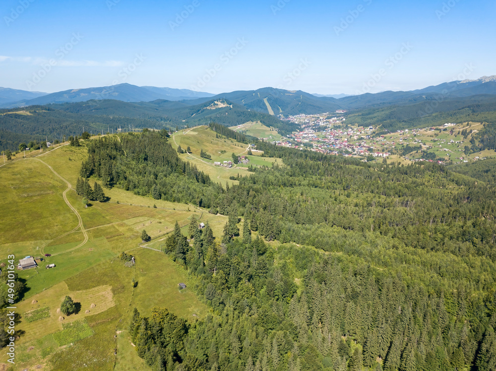 Fototapeta premium Green mountains of Ukrainian Carpathians in summer. Sunny clear day. Aerial drone view.