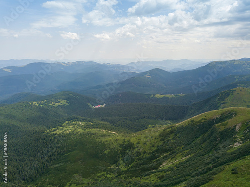 High mountains of the Ukrainian Carpathians in cloudy weather. Aerial drone view.