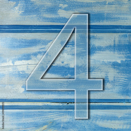 number four on wooden blue background photo