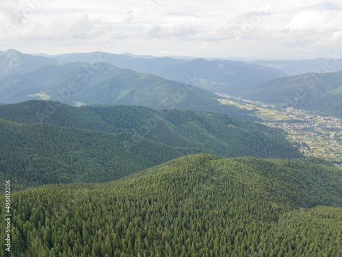 Green mountains of Ukrainian Carpathians in summer. Aerial drone view.