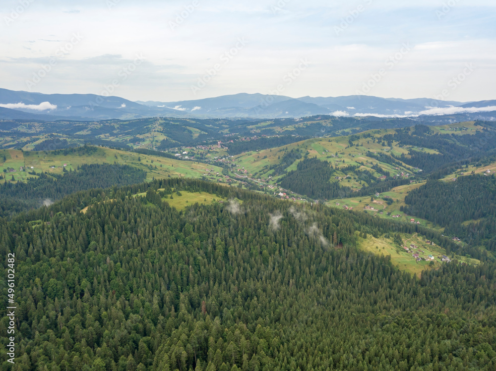 Green mountains of Ukrainian Carpathians in summer. Aerial drone view.