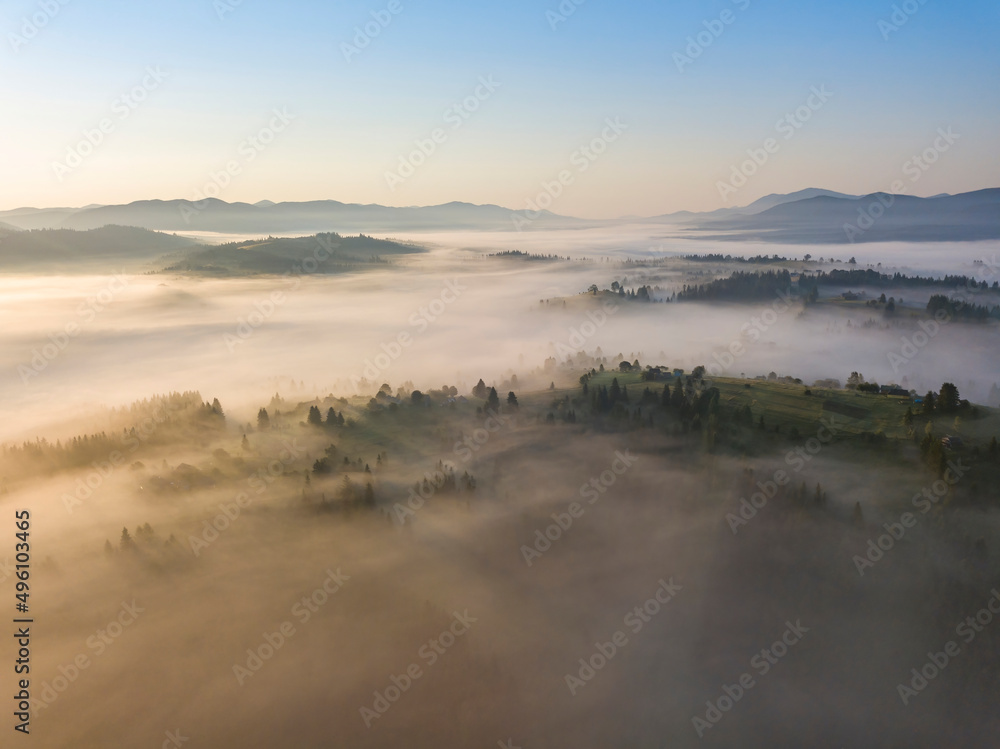 Morning fog in the Ukrainian Carpathians. Aerial drone view.