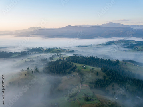 Sunrise over the fog in the Ukrainian Carpathians. Aerial drone view.