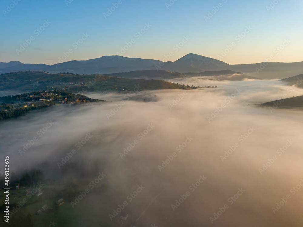 Morning fog in the Ukrainian Carpathians. Aerial drone view.