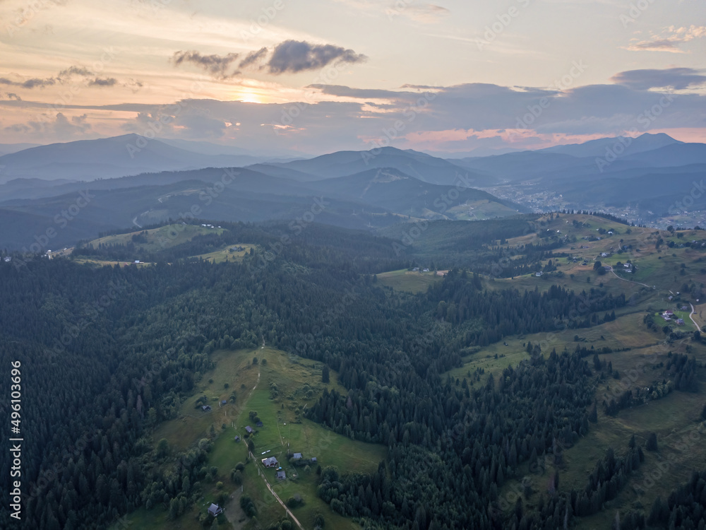 Fototapeta premium Sunset over the mountains in the Ukrainian Carpathians. Evening. Aerial drone view.