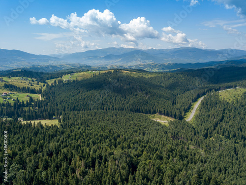 Green mountains of Ukrainian Carpathians in summer. Sunny day. Aerial drone view.