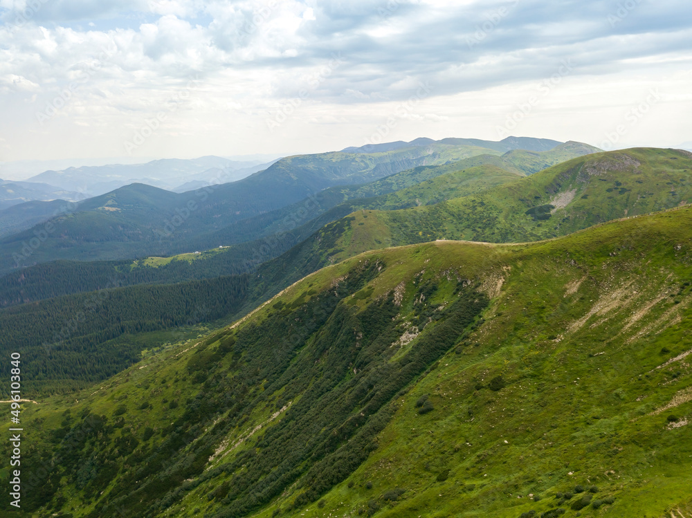 High mountains of the Ukrainian Carpathians in cloudy weather. Aerial drone view. High mountains of the Ukrainian Carpathians in cloudy weather. Aerial drone view.