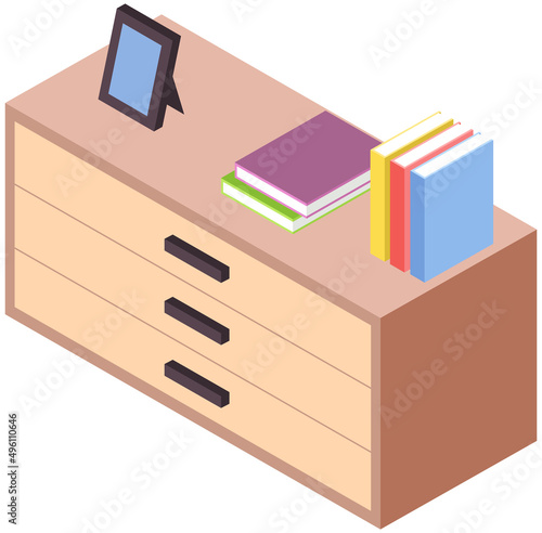 Wooden commode with drawers, bedside table. Furniture made of natural materials. Organization of home, nightstand. Books and decorations on chest of drawers. Element of home interior design
