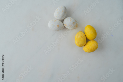 easter eggs in patriotic colors on a marble table. flat lay. place for text. minimalist concept happy