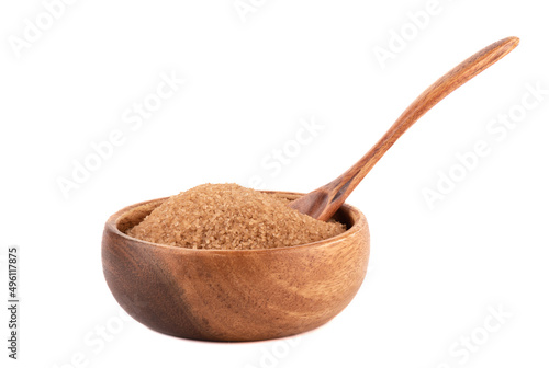 Fototapeta Naklejka Na Ścianę i Meble -  Wooden bowl with cane sugar and a wooden spoon on a white background.