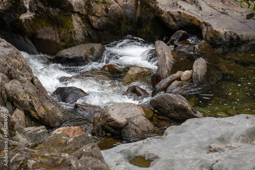 Long exposure photography of rocks in rapids/waterfalls of River Llugwy at Betws-y-Coed, Snowdonia, Wales
