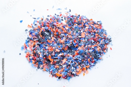 A pile of microplastics - small pieces of hard plastic, intended for further processing. Microplasts are said to settle in the human body. photo