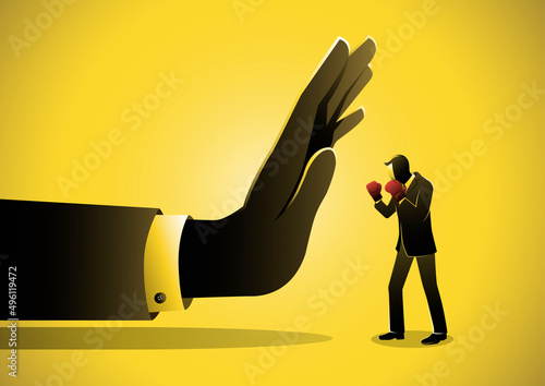 Small Businessman Against Giant Hand