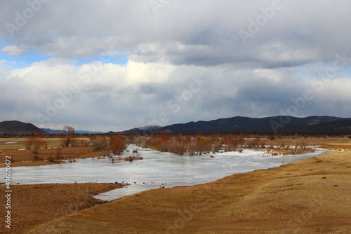 Frozen river landscape in springtime