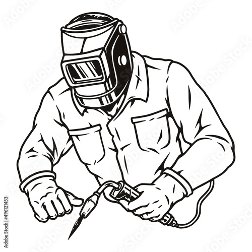 Worker in welding mask using gas torch