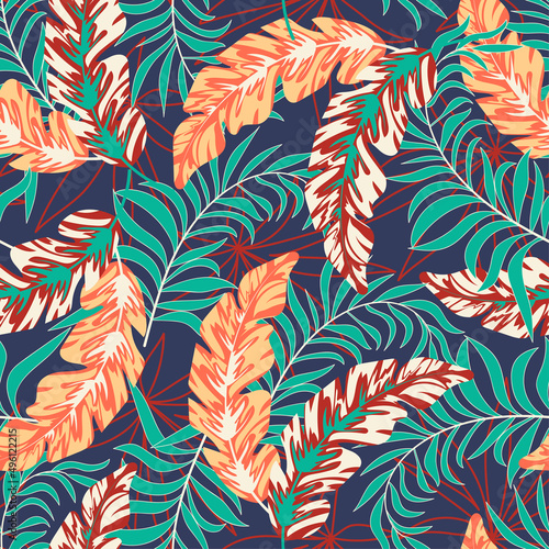 Summer seamless tropical pattern with bright plants and leaves on a purple background. Colorful stylish floral. Trendy summer Hawaii print. Seamless pattern with colorful leaves and plants. © EltaMax99