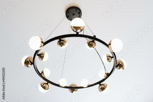 black metal lamp with lamps and light on a white background