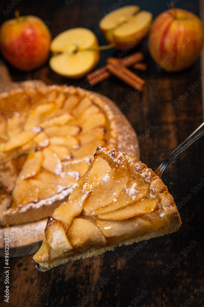 Delicious apple pie on a wooden table, from above