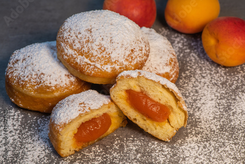 Freshly cooked Apricot jam doughnuts, referred to as jelly doughnuts, donuts in the US