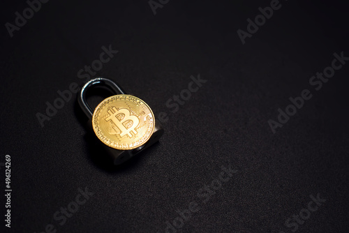 Bitcoin and lock. Cryptocurrency investment security and safety concept