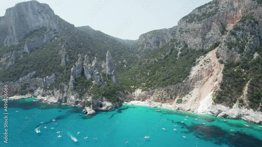 Aerial drone video of tropical paradise turquoise beach in the mediterranean, Cala Goloritzè Aerial drone video of tropical paradise turquoise beach in the mediterranean, Cala Goloritzè