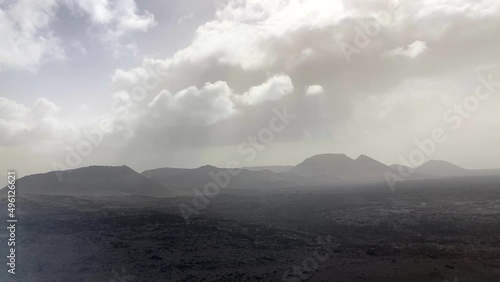 Smoke and steam coming from volcanoes in Timanfaya National Park, Lanzarote photo