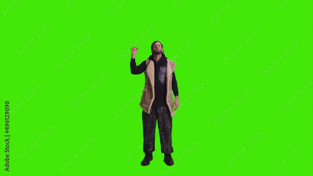 A young boy is standing and staring at camera on greenscreen A young boy is standing and staring at camera on greenscreen