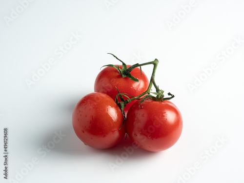 Bunch of cherry tomatoes and leaf tomatoes isolated on white background.