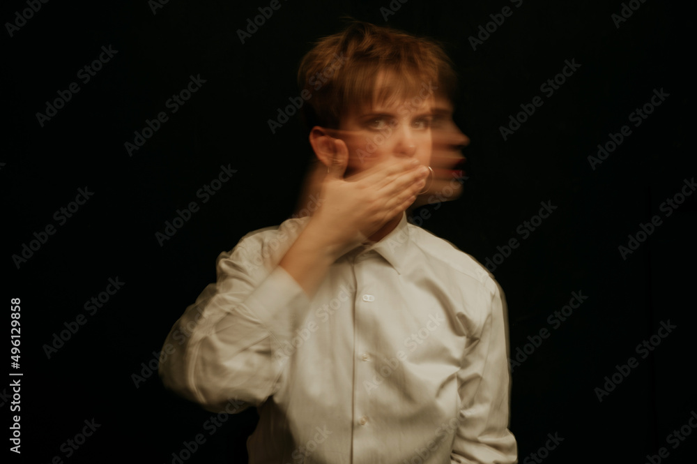 woman is a psychopath with schizophrenia and mental disorders. Portrait of a paranoid with anxiety on a dark background woman is a psychopath with schizophrenia and mental disorders. Portrait of a paranoid with anxiety on a dark background
