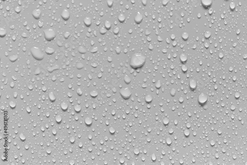 Water droplets on gray background covered with water droplets, bubbles in water.