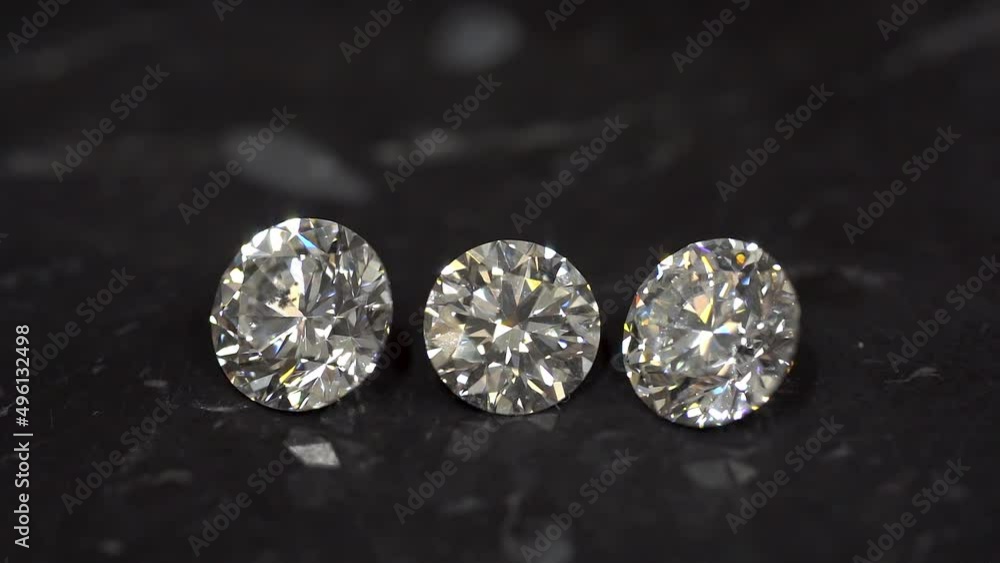 Diamonds are sparkling. Diamond shine. 1 carat diamonds close-up macro shot zoom out. 3 round cut diamonds. Diamonds are sparkling. Diamond shine. 1 carat diamonds close-up macro shot zoom out. 3 round cut diamonds.
