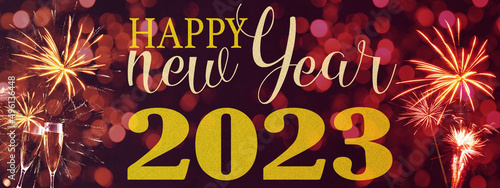 HAPPY NEW YEAR 2023 / New Year's Eve Holiday Event Party Firework - Festive silvester background panorama banner long - Golden fireworks and champagne classes toasting on dark night sky texture