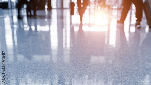 Motion blur legs of people walking in exhibition hall