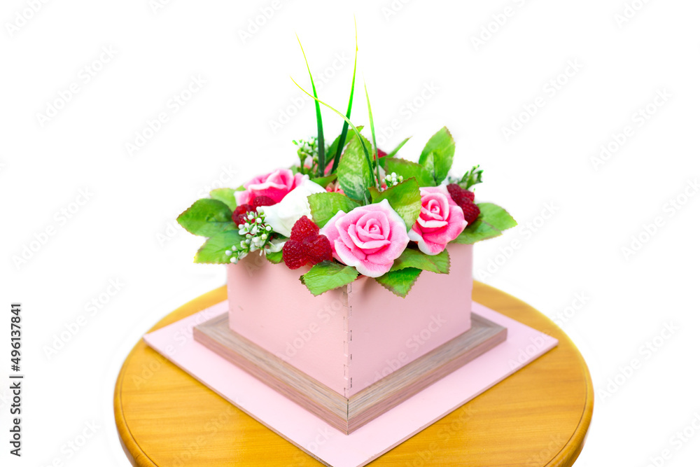 Obraz premium Composition of flowers and berries cardboard box isolated white background.