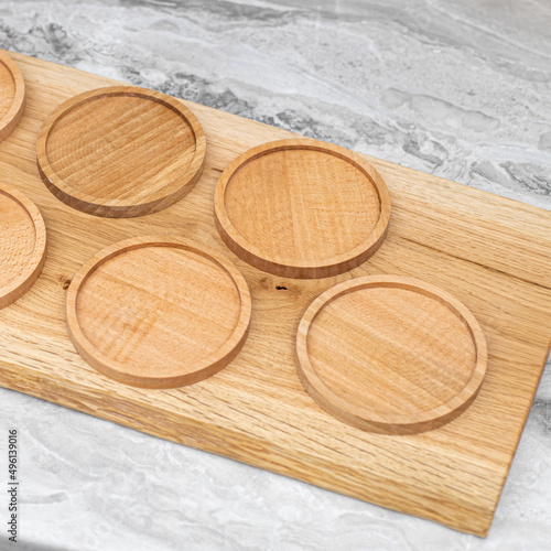 Natural Wooden coasters on the board