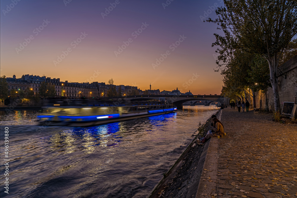 Beautiful and Colorful Twilight in Paris During Sunset From the Seine Docks Bridge and Buildings