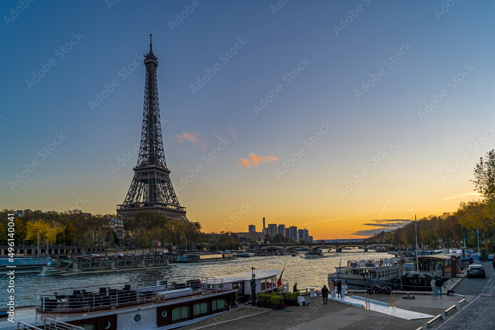 Blue Hour in Paris With Tourists Cruises on the Seine River and Eiffel Tower