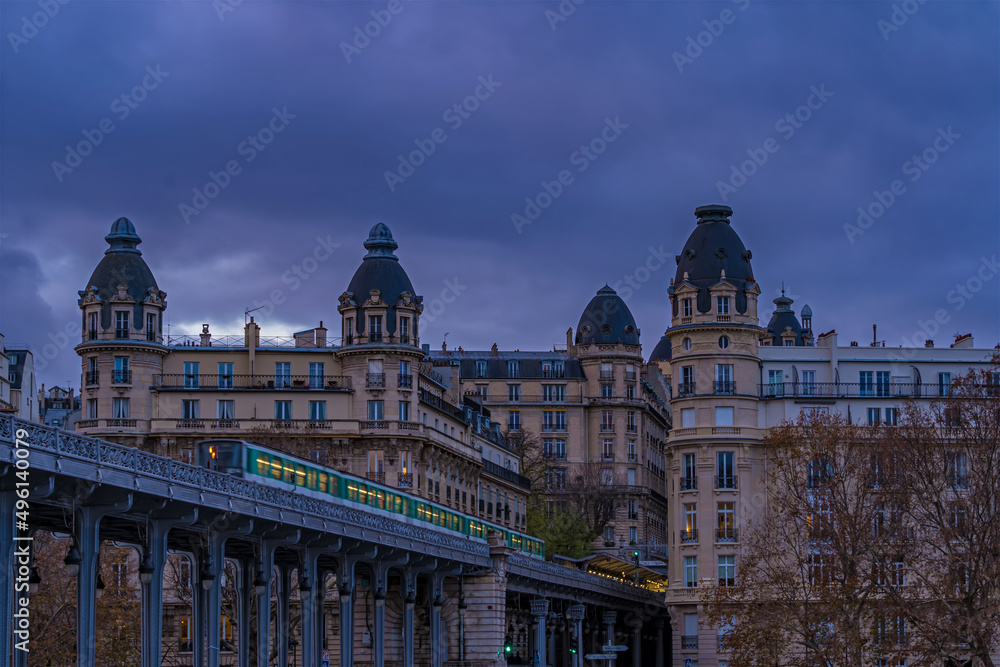 Subway on Bir Hakeim Bridge in Paris Under Cloudy Sky Historic Architecture
